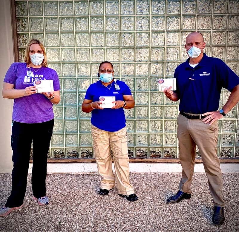 three people standing together